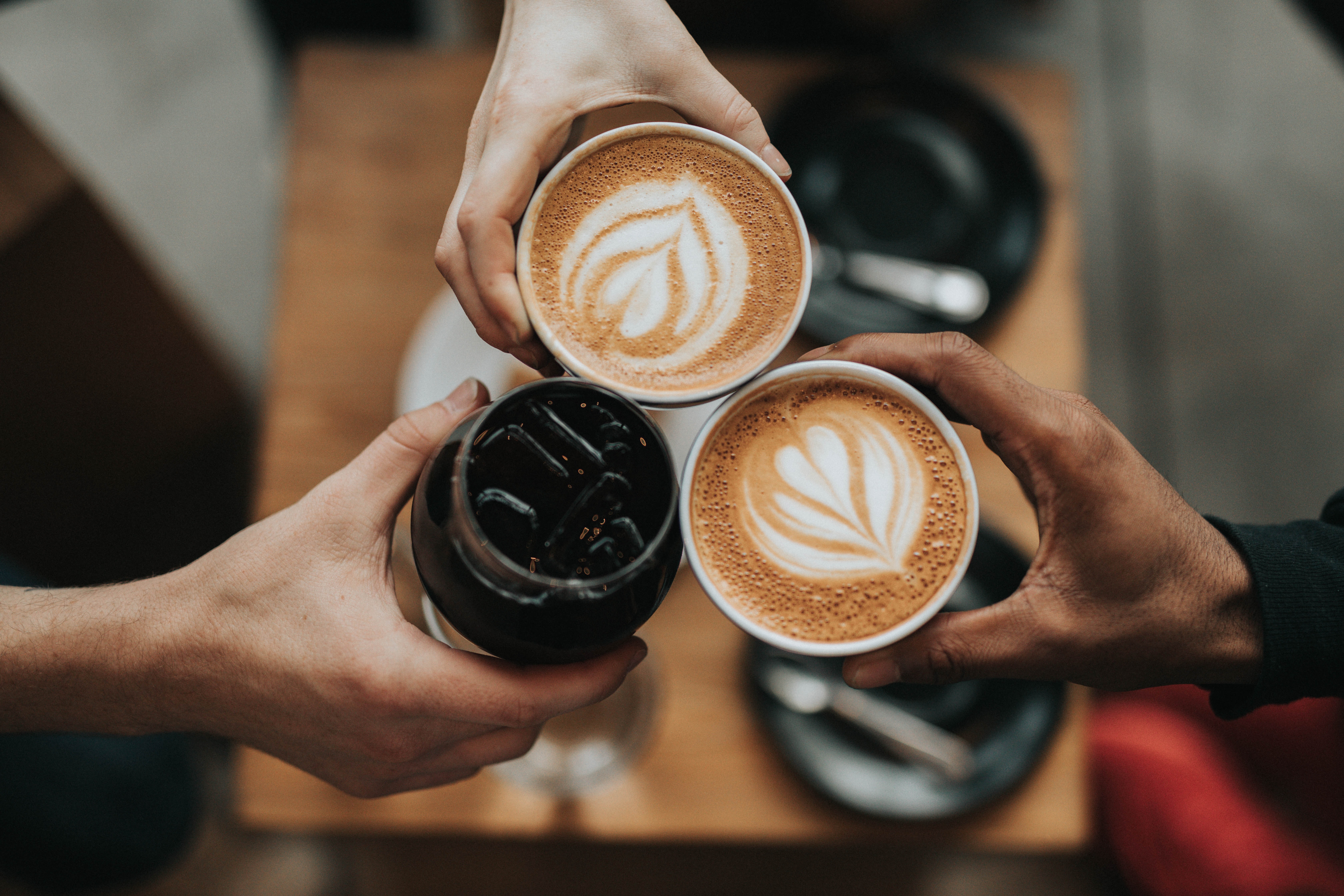 Photo by Nathan Dumlao on Unsplash - two coffees and a coca cola